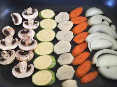 sliced vegetables on griddle