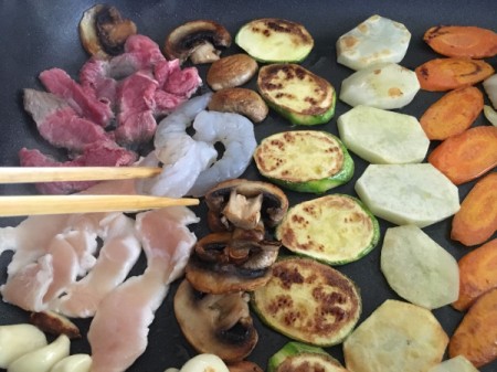 turning vegetables on griddle