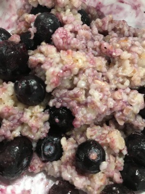 Oatmeal with frozen blueberries added.