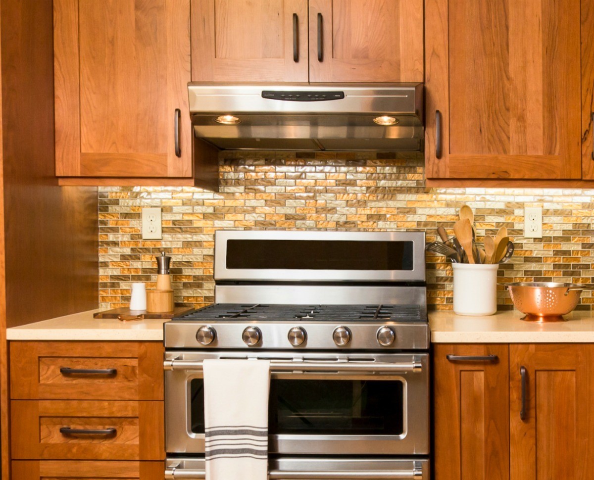 kitchen stove beside wall