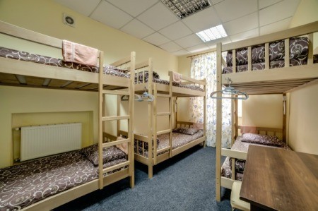 A bedroom with several bunk beds.