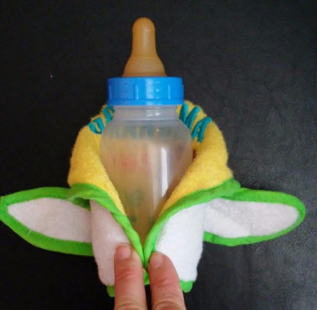 Baby Bib Robe - both tabs/ties folded down and behind the bottle