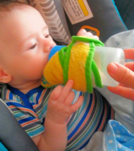 Baby Bib Robe - baby drinking from the bib wrapped bottle