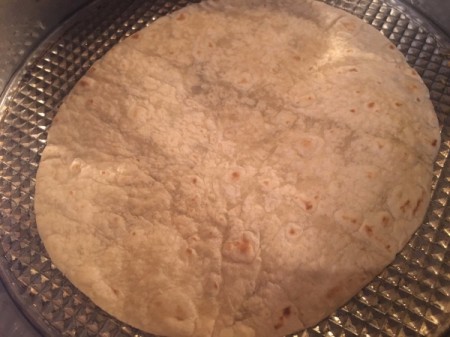 tortilla on baking sheet