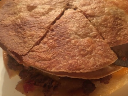 Towering Taco Pizza cut in wedges