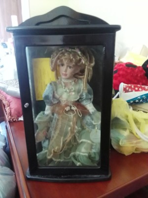 Value of a Knightbridge Collection Doll - doll in a black box with glass front