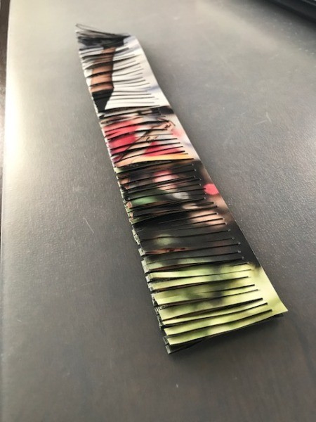 Recycled Catalog Flowers - finished cutting one folded page