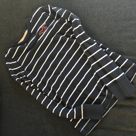 A longsleeved striped shirt, to be used for decorating a cardboard box.