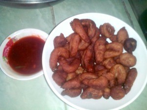 finished Fried Fish Drops on plate with bowl of sauce