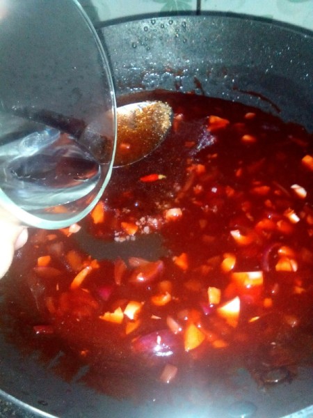water added to sauce ingredients in pan
