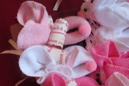 Make Boo-Boo Bunnies For a Baby Shower - tags attached to bunnies with elastic