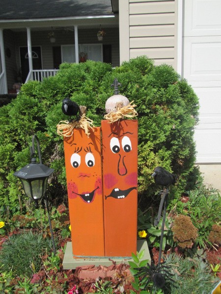 Scrap Wood Halloween Decorations - goofy pumpkin like faces