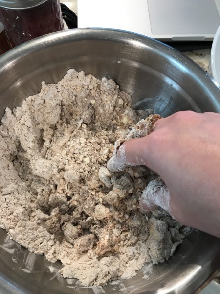 mixing dough with fingers