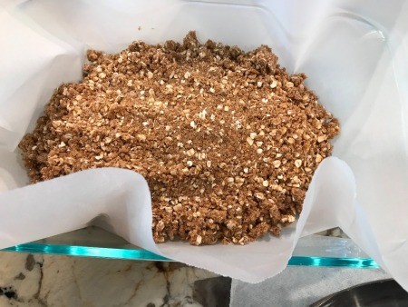 dough flattened on parchment paper