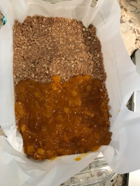 mango filling on half of bottom crust