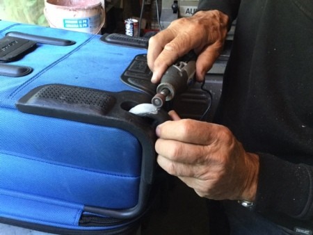 Repairing a Lopsided Luggage Wheel - sand to shape