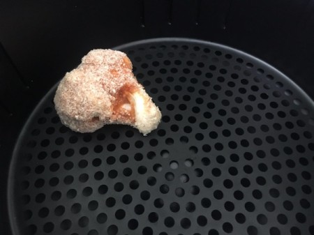 coated cauliflower piece on air fryer