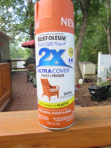 A can of orange spray paint.