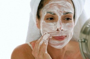 Woman Applying Moisturizer