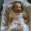Value of an Ashton Drake Doll - baby doll wearing a long gown