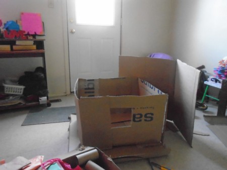 Making a Cardboard Dog House - glue on the rest of the walls