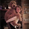 Molly and Mally (Goldendoodle) - young girl holding a dog