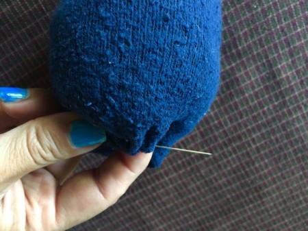 Mini Sock Pumpkins - using a needle with a long thread loosely sew up the opening