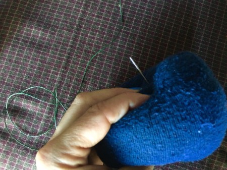 Mini Sock Pumpkins - poke needle through the center and out the other side