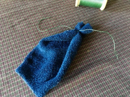 Mini Sock Pumpkins - for the top half of the sock with the two openings, turn sock inside out and tie one end closed then turn right side out
