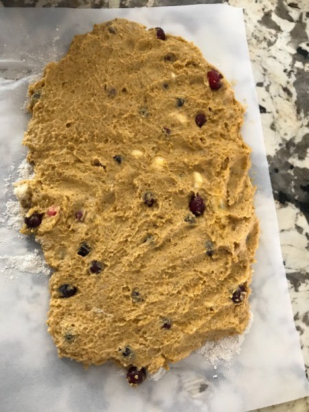flattened dough on parchment paper