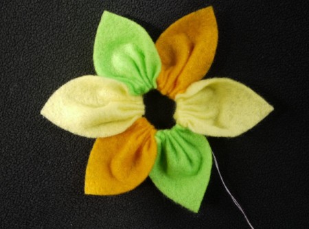 Felt Flower Brooch - gently pull the thread to gather the petals and secure with a backstitch