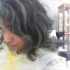 Hair has been dyed and has turned a greenish color.