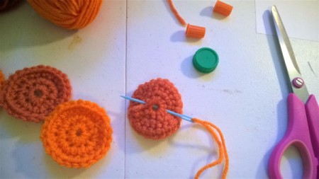 Cute Little Crochet Circle Pumpkin - use double yarn threaded on needle to stitch circles together