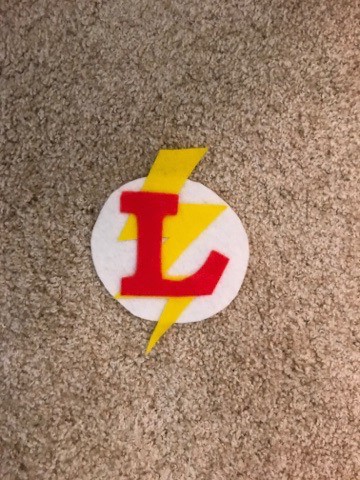 A logo for The Flash, made from felt pieces.