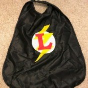 A black cape with the colored The Flash logo in the center.