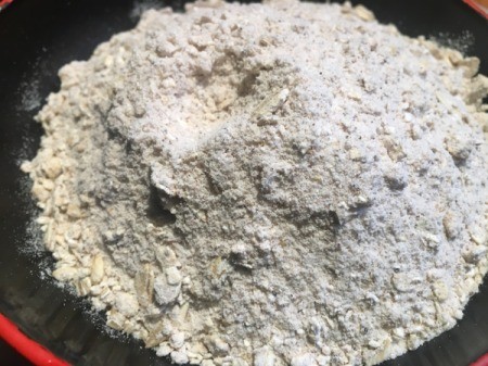 mixing topping of flour, oats and sugar