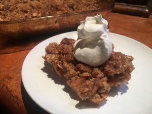 Healthy Apple Crisp on plate with whipped cream