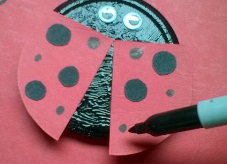 Recycled Metal Lid Ladybird (Ladybug) Wall Decoration - adding smaller dots with the marker