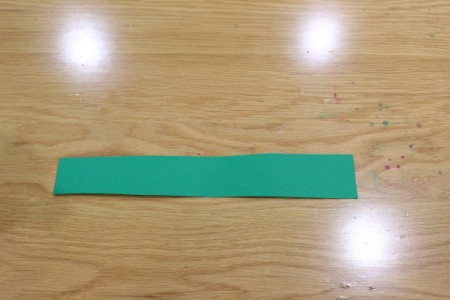 Halloween Frankenstein Soda Bottle Craft - 2" rectangle of green paper 1" longer than bottle circumfrence