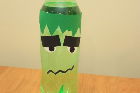 Halloween Frankenstein Soda Bottle Craft - tape mouth in place