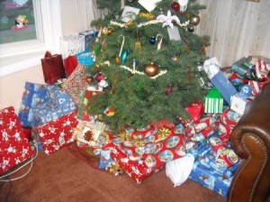 A Christmas tree with wrapped presents underneath.