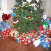 A Christmas tree with wrapped presents underneath.