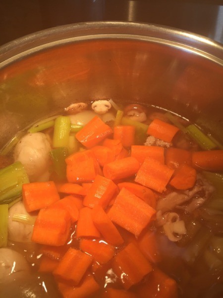 carrots, mushrooms, and carrots in pot