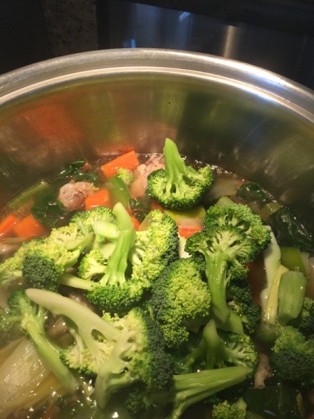 broccoli and cauliflower added to pot in pot