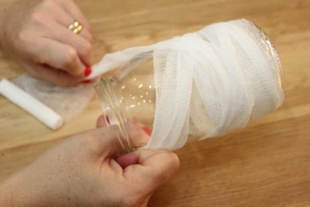 Halloween Mummy Jar Decoration - begin wrapping in different directions to make it look more like a mummy