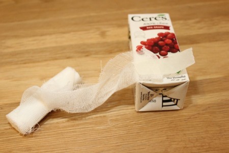 Halloween Mummy Juice Box - begin wrapping in gauze of tape