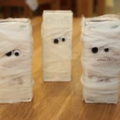 3 juice boxes wrapped to look like mummies.