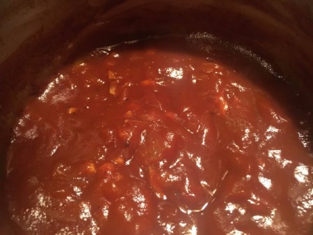simmering sauce on stove