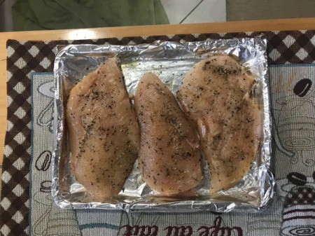 Seasoned Chicken Breasts on baking train
