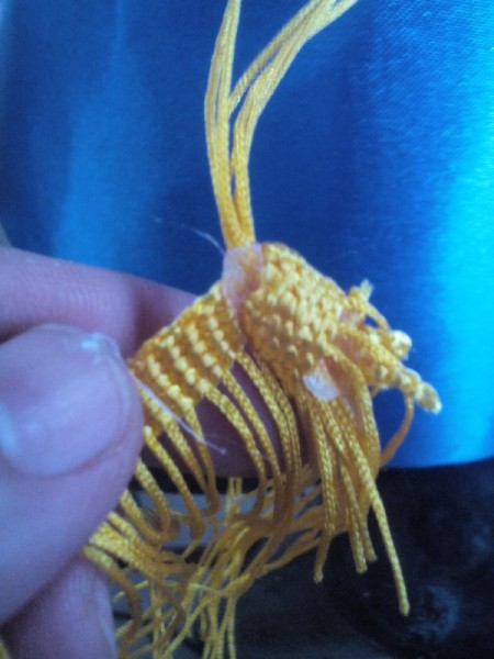 DIY Turkish Fez - wrap full tassel material around the string and attach